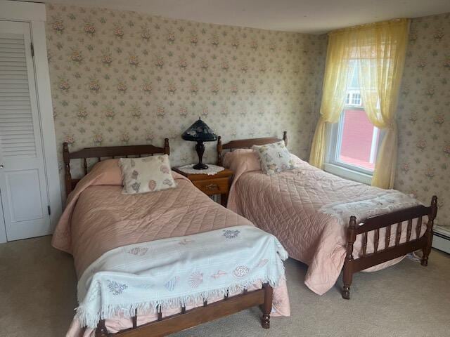 bedroom featuring carpet floors and wallpapered walls