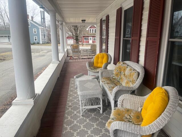 balcony featuring a sunroom and covered porch