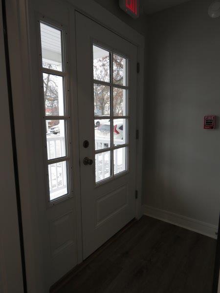 entryway featuring baseboards and dark wood finished floors