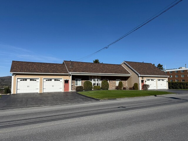 182 E Main St, Fort Kent, ME 04743 - single story home with a garage, a front yard, and asphalt driveway