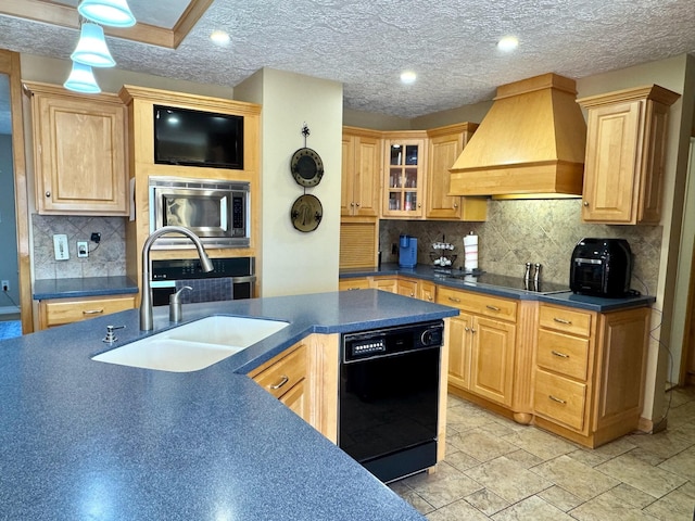 182 E Main St, Fort Kent, ME 04743 - kitchen with black appliances, custom exhaust hood, dark countertops, a sink, and backsplash