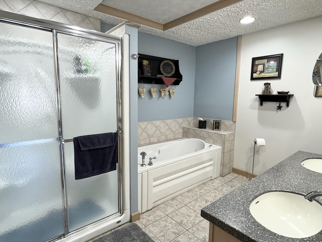 182 E Main St, Fort Kent, ME 04743 - bathroom featuring a textured ceiling, a garden tub, a shower stall, tile patterned flooring, and double vanity