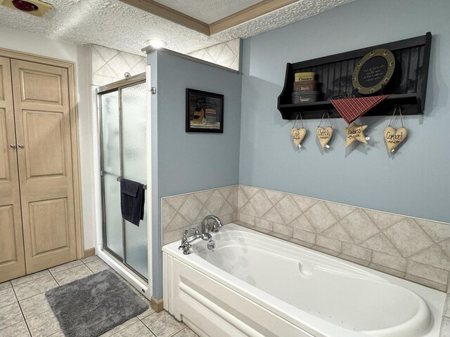 182 E Main St, Fort Kent, ME 04743 - full bathroom featuring tile patterned floors, a textured ceiling, a bath, and a stall shower