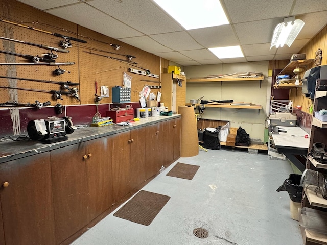 182 E Main St, Fort Kent, ME 04743 - below grade area featuring a workshop area and a paneled ceiling