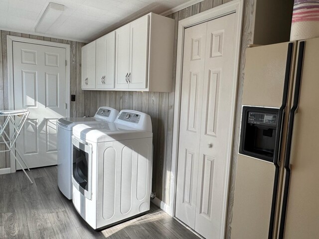 182 E Main St, Fort Kent, ME 04743 - laundry area featuring separate washer and dryer, cabinet space, and wood finished floors