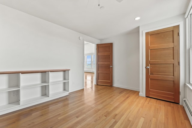 6 Merritt House Rd Unit 20, Harpswell, ME 04066 - spare room featuring light wood-style floors, a baseboard heating unit, recessed lighting, and baseboards