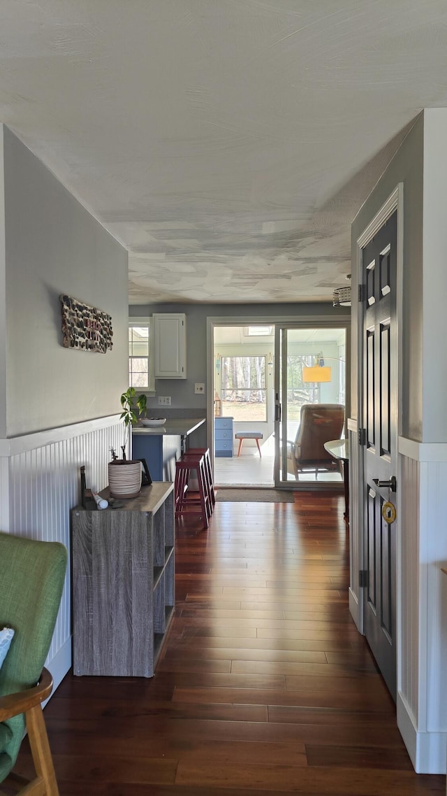 54 Black Smith Rd Unit 13, Wells, ME 04090 - hallway featuring wainscoting and dark wood-type flooring