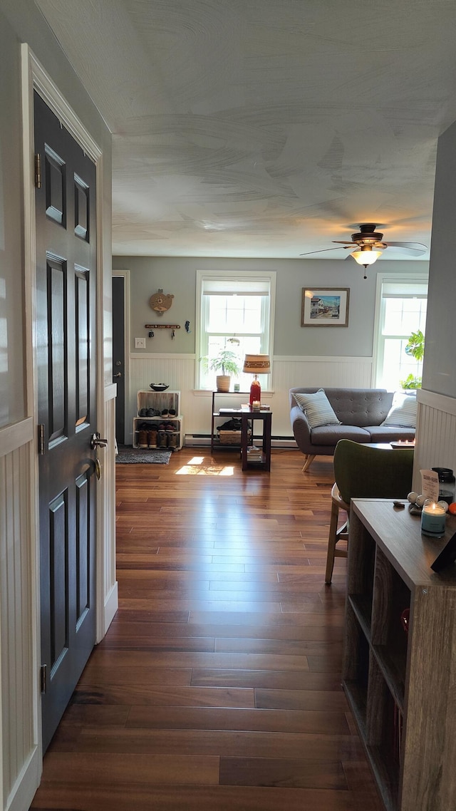 54 Black Smith Rd Unit 13, Wells, ME 04090 - interior space featuring ceiling fan, wainscoting, and dark wood-style floors