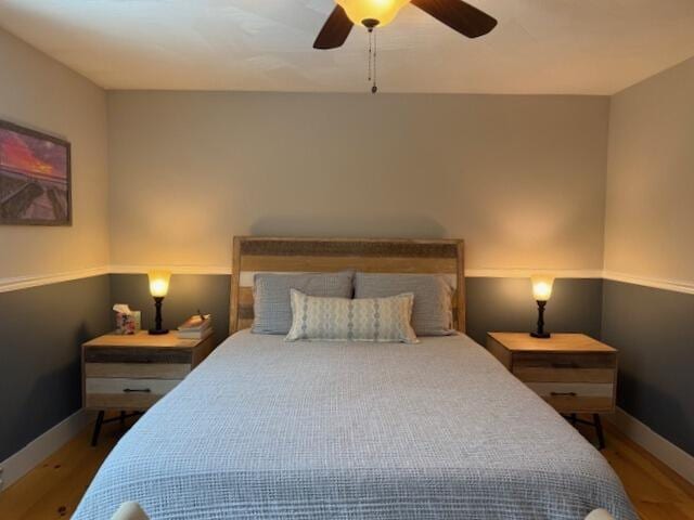 54 Black Smith Rd Unit 13, Wells, ME 04090 - bedroom with a ceiling fan, baseboards, and wood finished floors