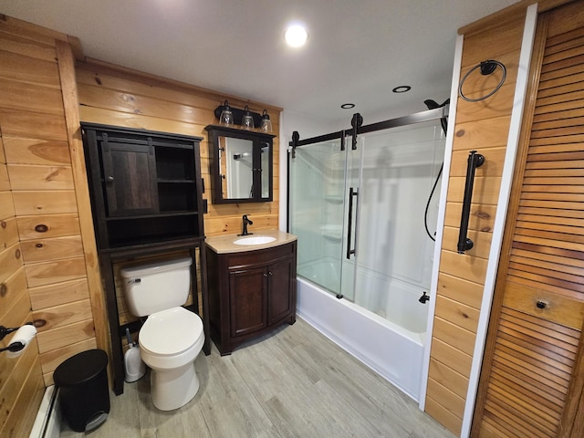 1898 Roxbury Rd, Roxbury, ME 04275 - bathroom featuring wood finished floors, toilet, vanity, bath / shower combo with glass door, and recessed lighting