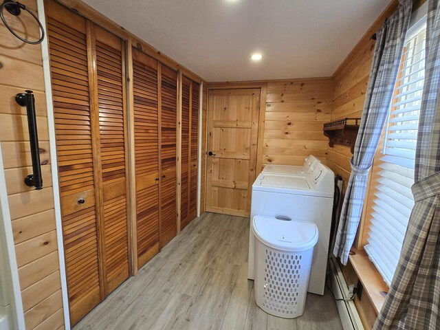 1898 Roxbury Rd, Roxbury, ME 04275 - laundry area with washing machine and clothes dryer, light wood-type flooring, and wood walls