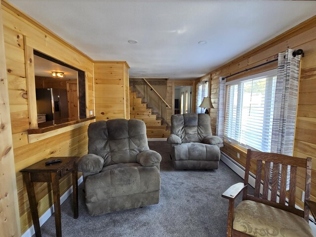 1898 Roxbury Rd, Roxbury, ME 04275 - living room featuring wood walls, stairs, and carpet