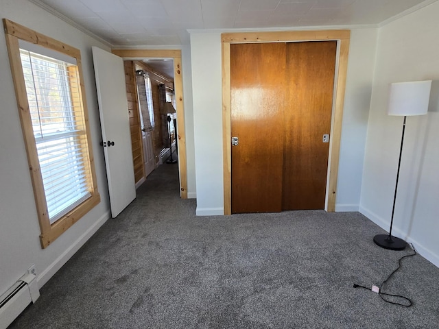 1898 Roxbury Rd, Roxbury, ME 04275 - unfurnished bedroom featuring baseboard heating, carpet, crown molding, and baseboards