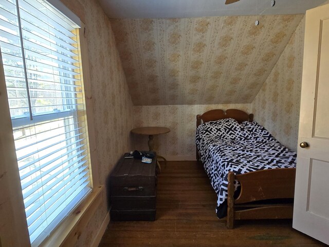1898 Roxbury Rd, Roxbury, ME 04275 - bedroom with hardwood / wood-style flooring, wallpapered walls, and vaulted ceiling