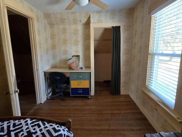 1898 Roxbury Rd, Roxbury, ME 04275 - bedroom featuring dark wood finished floors, wallpapered walls, a desk, and a ceiling fan