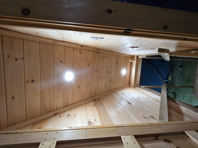1898 Roxbury Rd, Roxbury, ME 04275 - basement featuring wood-type flooring, wood walls, and wooden ceiling
