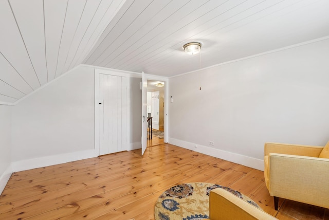 bonus room with light wood finished floors, lofted ceiling, and wooden ceiling