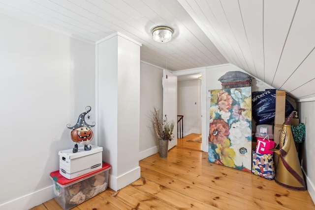 additional living space featuring wood ceiling, hardwood / wood-style flooring, and lofted ceiling