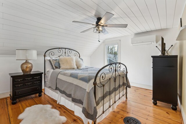 bedroom with wood ceiling, ceiling fan, an AC wall unit, lofted ceiling, and light wood-style flooring