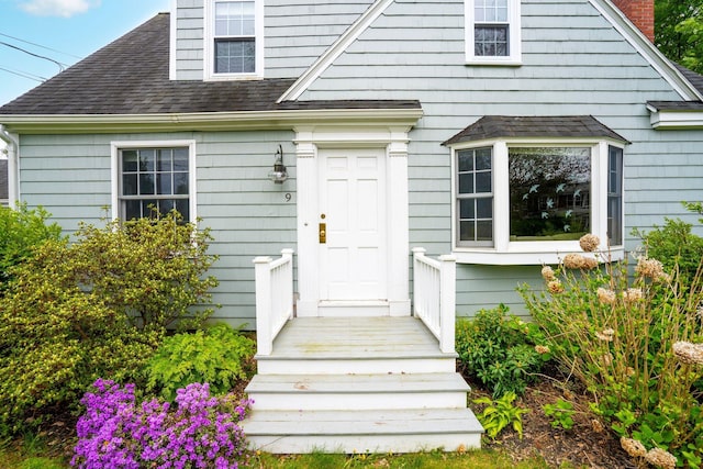 9 Phillips Rd, Falmouth, ME 04105 - doorway to property with roof with shingles and a chimney