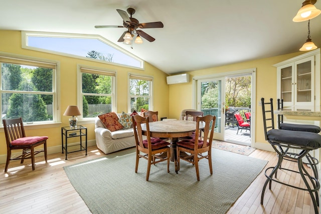 9 Phillips Rd, Falmouth, ME 04105 - dining area featuring plenty of natural light, a wall mounted AC, light wood-style floors, vaulted ceiling, and a ceiling fan