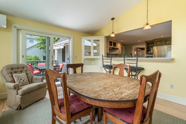 9 Phillips Rd, Falmouth, ME 04105 - dining area with wood finished floors, lofted ceiling, and baseboards