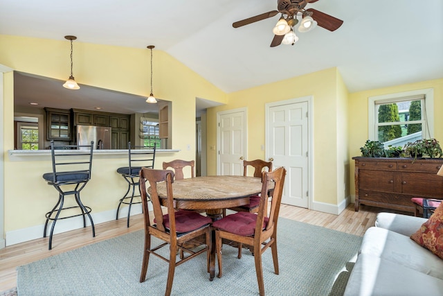 9 Phillips Rd, Falmouth, ME 04105 - dining space featuring vaulted ceiling, ceiling fan, healthy amount of natural light, light wood-type flooring, and baseboards