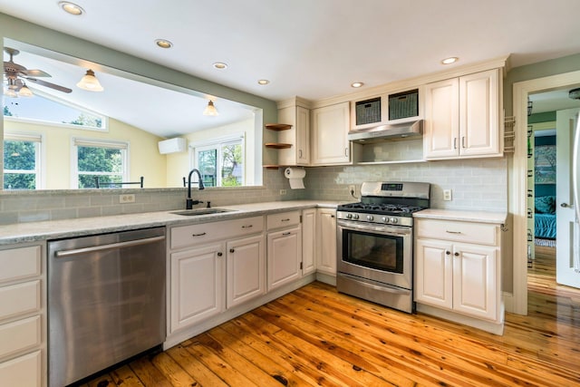 9 Phillips Rd, Falmouth, ME 04105 - kitchen featuring appliances with stainless steel finishes, a sink, under cabinet range hood, light wood-style floors, and open shelves
