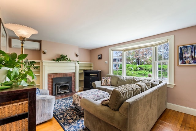 9 Phillips Rd, Falmouth, ME 04105 - living area featuring a wall unit AC, hardwood / wood-style floors, and baseboards