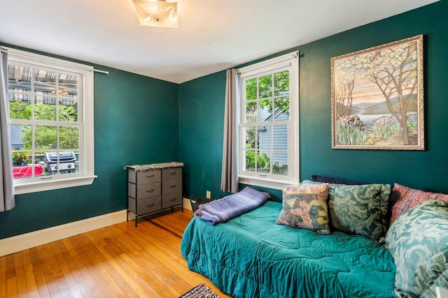 9 Phillips Rd, Falmouth, ME 04105 - bedroom with hardwood / wood-style flooring, baseboards, and multiple windows
