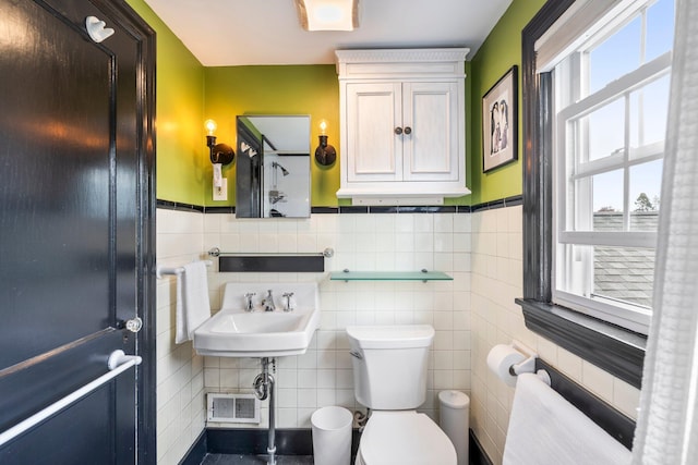 9 Phillips Rd, Falmouth, ME 04105 - bathroom with toilet, tile walls, and a wainscoted wall