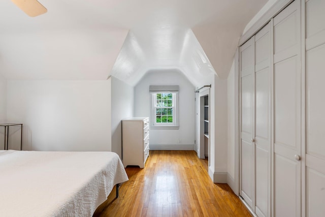 9 Phillips Rd, Falmouth, ME 04105 - bedroom featuring light wood-style flooring, lofted ceiling, and baseboards