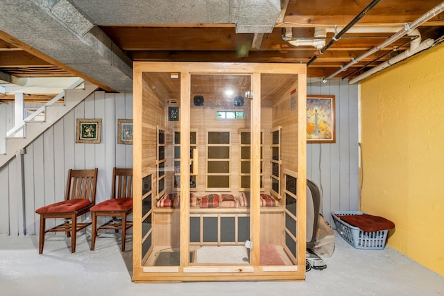 9 Phillips Rd, Falmouth, ME 04105 - unfinished below grade area featuring wooden walls, stairway, and a sauna / steam room