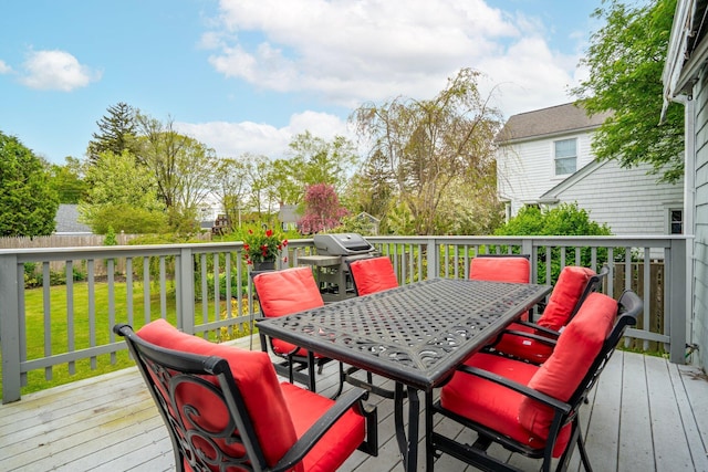 9 Phillips Rd, Falmouth, ME 04105 - deck with outdoor dining area, a lawn, and area for grilling