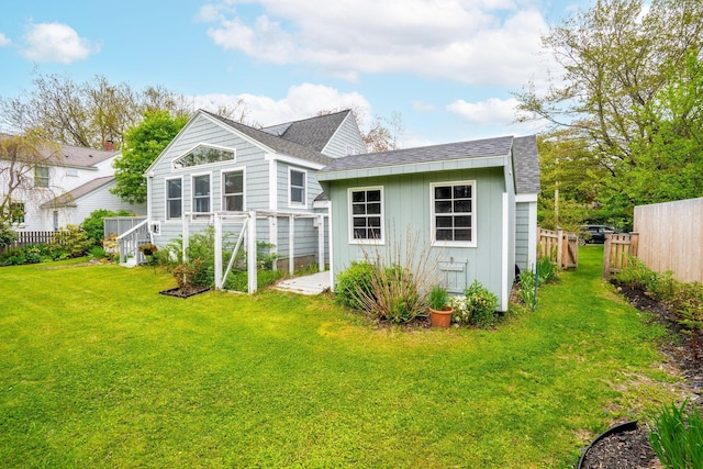 9 Phillips Rd, Falmouth, ME 04105 - back of house with a shingled roof and board and batten siding