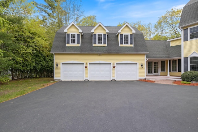 6 Jason Ln, Ogunquit, ME 03907 - view of front of home with driveway, a garage, and a shingled roof