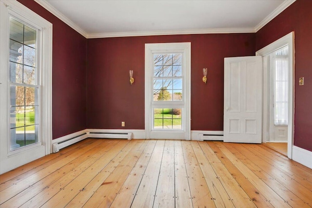 foyer entrance featuring crown molding, baseboard heating, hardwood / wood-style floors, baseboards, and a baseboard heating unit