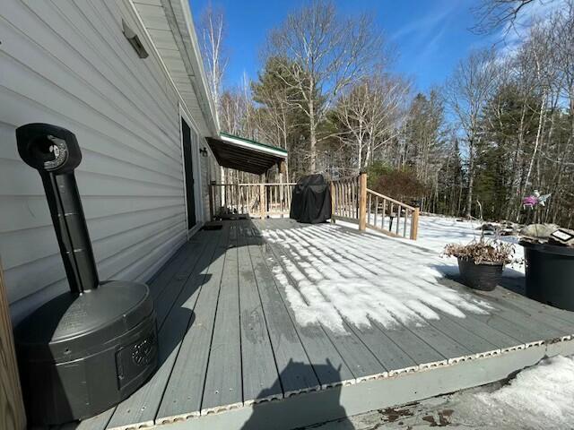 view of snow covered deck