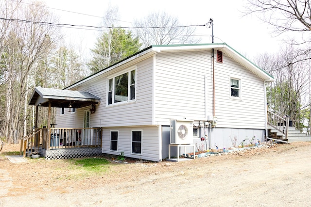 69 Goulds Ridge Rd, Passadumkeag, ME 04475 - view of property exterior featuring a deck and a cooling unit