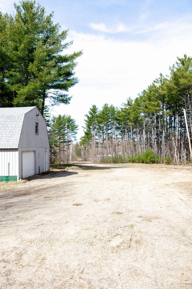 69 Goulds Ridge Rd, Passadumkeag, ME 04475 - view of yard with a garage, an outdoor structure, driveway, and a barn