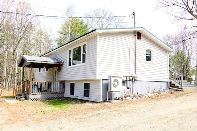 69 Goulds Ridge Rd, Passadumkeag, ME 04475 - view of property exterior with a deck and ac unit