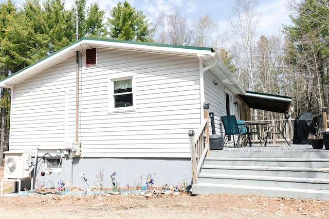 69 Goulds Ridge Rd, Passadumkeag, ME 04475 - view of property exterior with a cooling unit and a deck