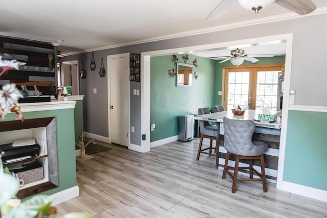 69 Goulds Ridge Rd, Passadumkeag, ME 04475 - dining area with a ceiling fan, crown molding, baseboards, light wood-style floors, and french doors