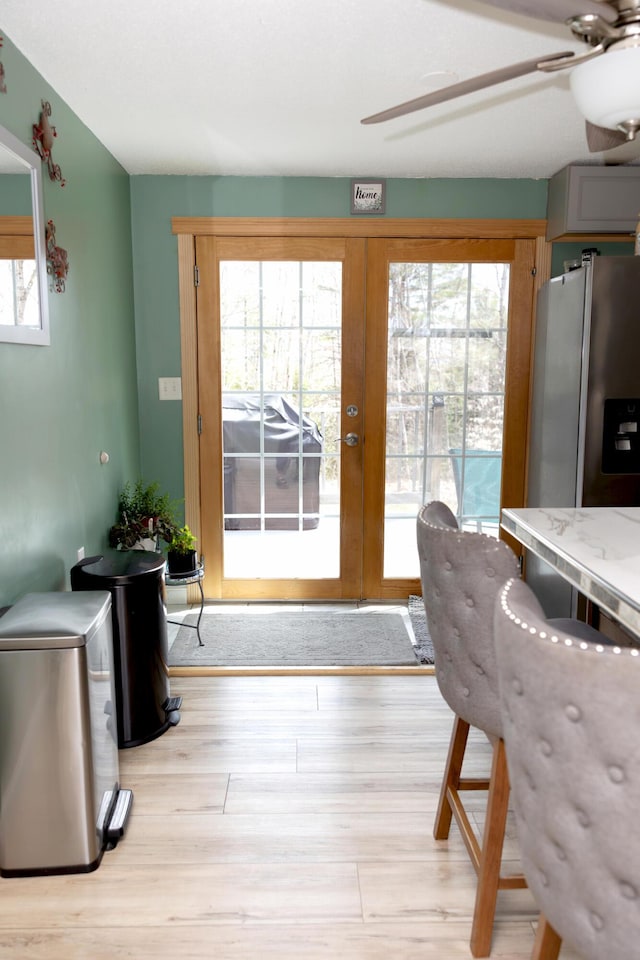 69 Goulds Ridge Rd, Passadumkeag, ME 04475 - dining space featuring ceiling fan, wood finished floors, and french doors