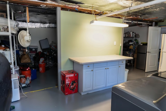 69 Goulds Ridge Rd, Passadumkeag, ME 04475 - below grade area featuring freestanding refrigerator and washing machine and clothes dryer