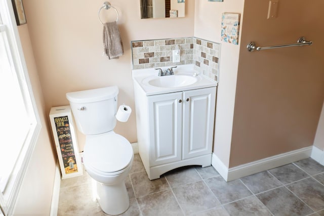 69 Goulds Ridge Rd, Passadumkeag, ME 04475 - bathroom with toilet, backsplash, vanity, and baseboards
