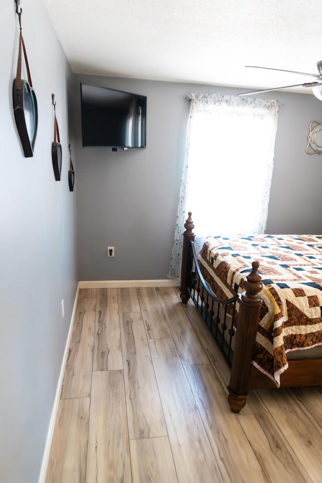 69 Goulds Ridge Rd, Passadumkeag, ME 04475 - bedroom with wood finished floors and baseboards