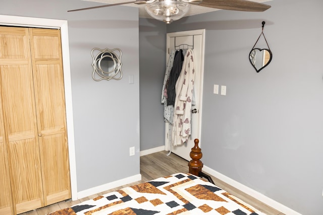 69 Goulds Ridge Rd, Passadumkeag, ME 04475 - unfurnished bedroom featuring baseboards, light wood-style floors, and a ceiling fan