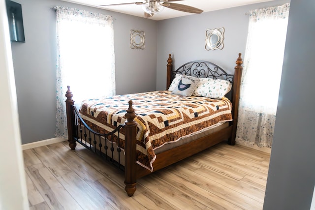 69 Goulds Ridge Rd, Passadumkeag, ME 04475 - bedroom with wood finished floors, a ceiling fan, and baseboards