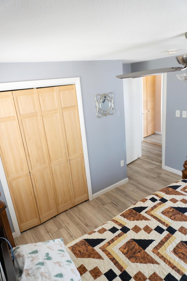 69 Goulds Ridge Rd, Passadumkeag, ME 04475 - bedroom featuring light wood finished floors, baseboards, and a closet